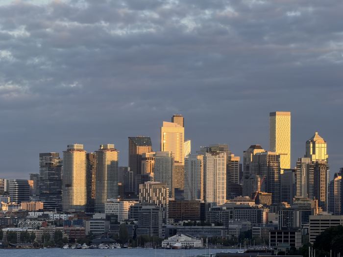 Downtown Seattle towers catching golden-hour light over Lake Union